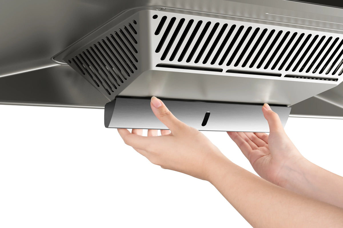 Hands removing the oil tray from ROBAM CleanAir 1.0 A8320 stainless steel rangehood