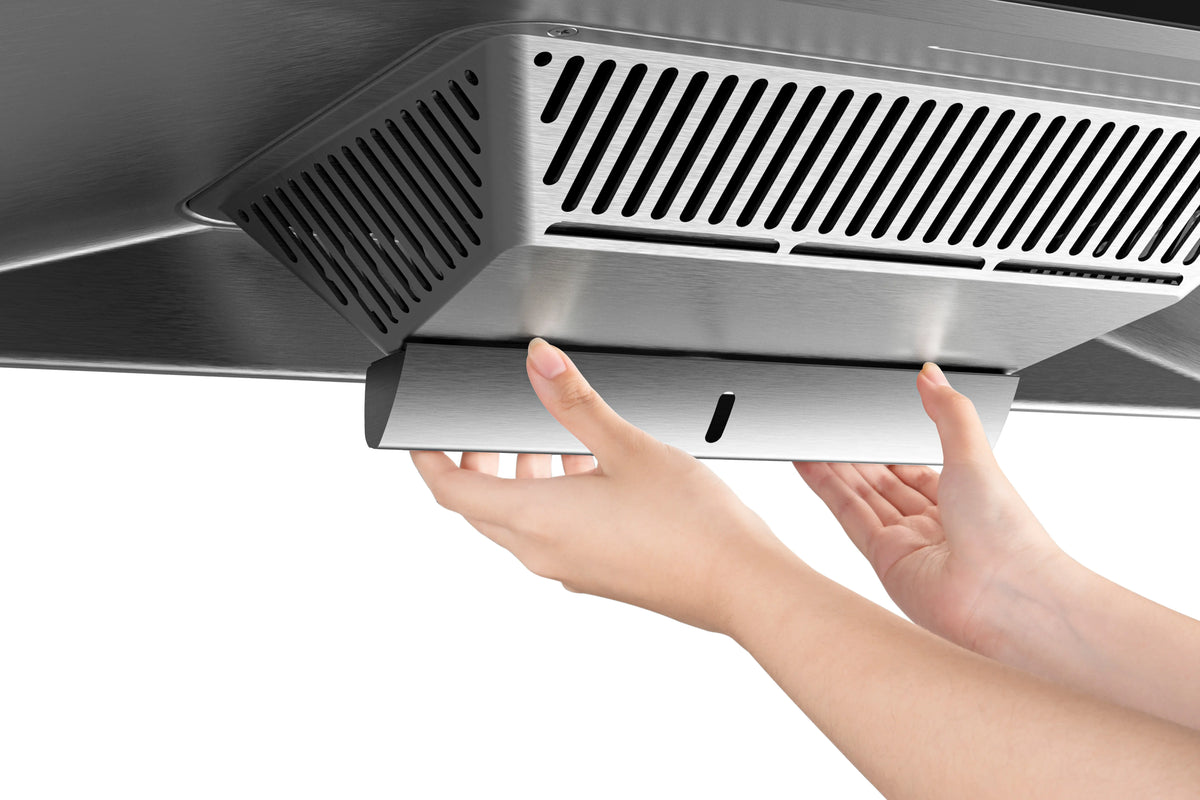 Hands removing the oil tray from ROBAM CleanAir 2.0 A8323 stainless steel rangehood